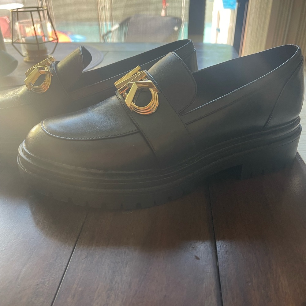 Michael Kors Black Slip-Ons with Gold Logo
